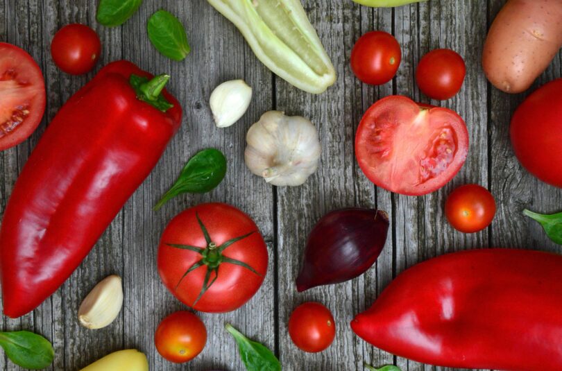 Ingredients such as tomatoes, garlic and peppers for a pinquito bean chili recipe